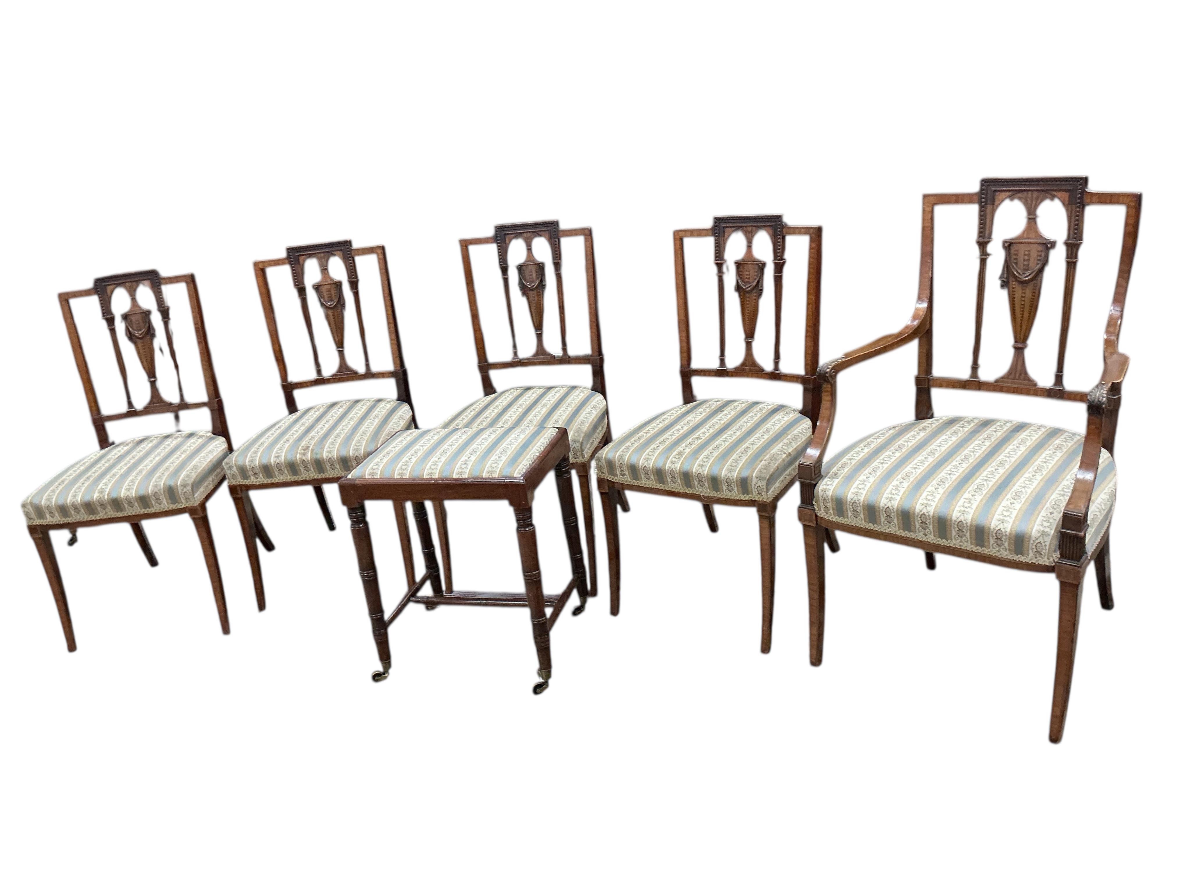 A set of five Edwardian Sheraton revival mahogany and marquetry dining chairs, one with arms, and a Victorian dressing stool